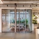 a meeting room with curved glass 