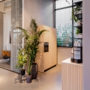The coffee corner with on the leftside a meeting roomq