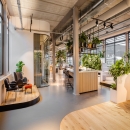 A meeting room in the background with curved glass