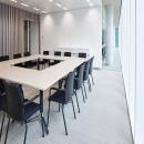 Meeting room with high acoustic glass partition.