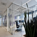 Small glass concentration unit made of acoustic layered single glass and aluminum frame and a full glass door. 