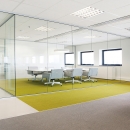 Full glass system wall with seamless joints
