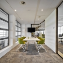 Conversation room with glass partition wall and closed elements