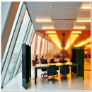 Working space with QbiQ partition wall covered with a pink film