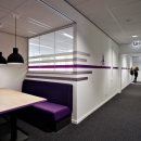 Single glass partition placed in existing wall