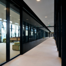 Corridor with a meeting room on the left side