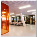 Curved glass partition wall with pink film