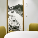 Oval conversation room made of single glass and closed panels