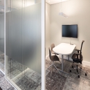 Room for private conversation made of double glass with acoustic foil