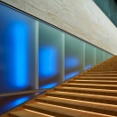 Blue light behind the IQ-Single glass wall at Pulse Delft