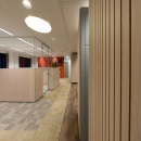 Single glass box office with wood paneling