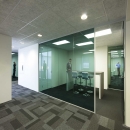 Blue colored single glass partition wall