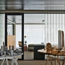 Glass partition with black profiles.