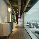 Offices with barn doors and glass partitions.