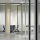 Aluminum framed door in glass partition