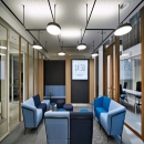 Single glass partition with wood elements added