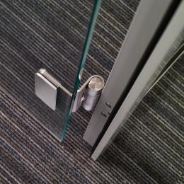 Detail of a stainless steel hinge in the DK42 door frame