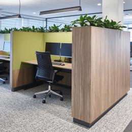Office work desk with in the background a QbiQ glass partition