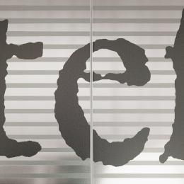 Glass partition wall with text print