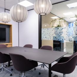Meeting room with glass and closed wall parts at Novo Nordisk Alphen aan den Rijn