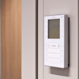 Service panel besides a door